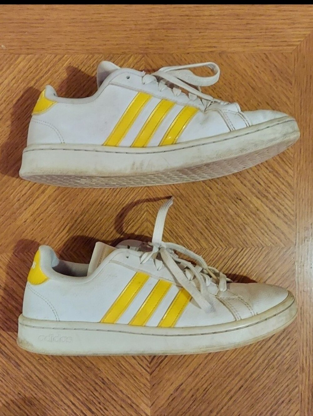White & yellow adidas sneakers